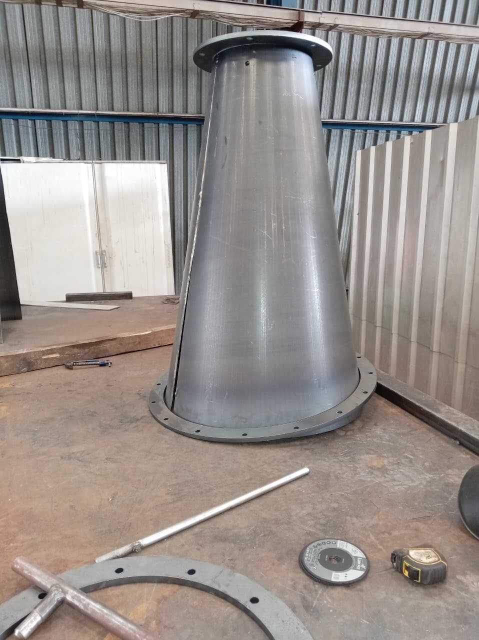 Rolled and seam-welded cone section